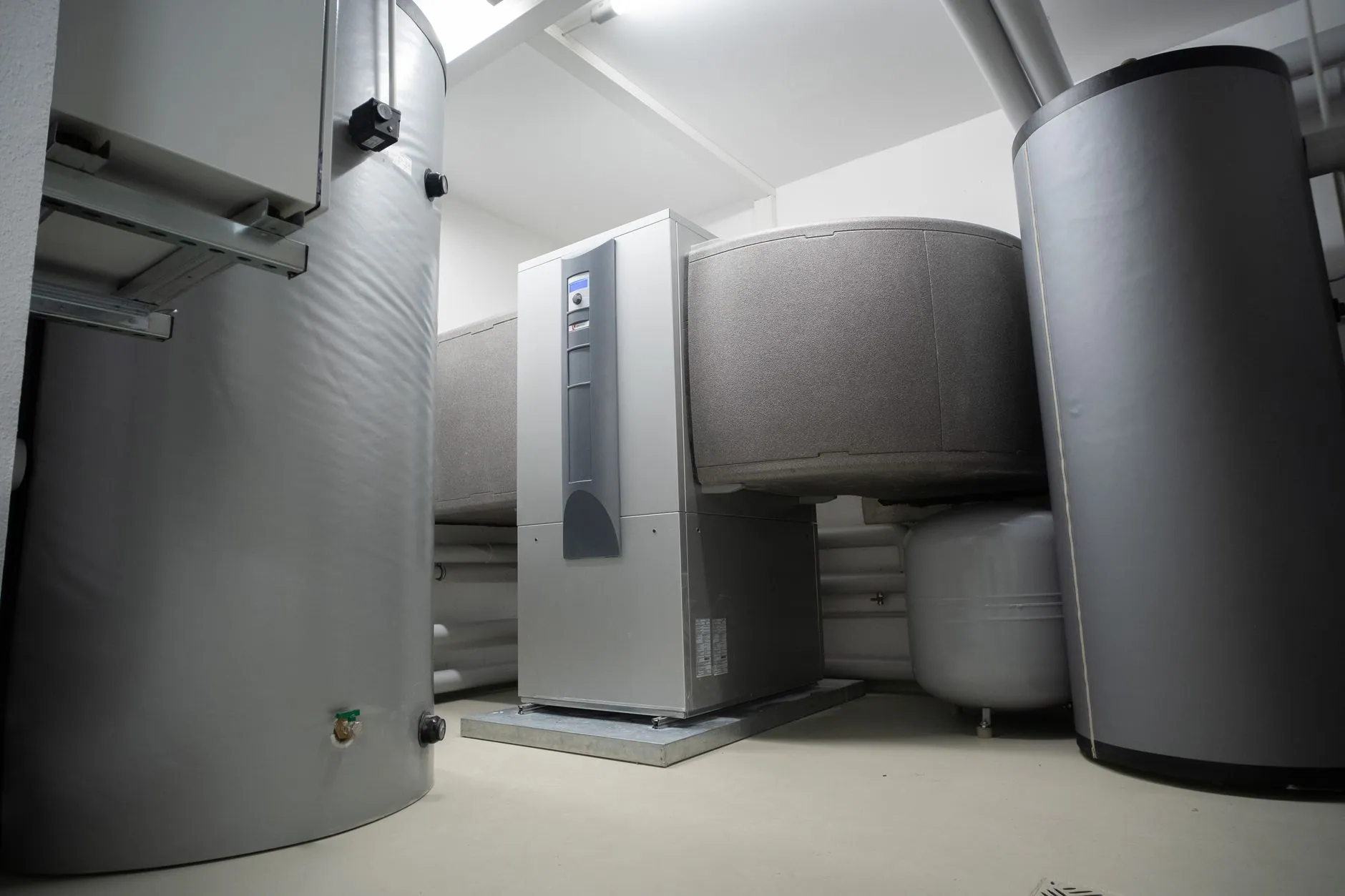 Commercial air-source heat pump units beside a building